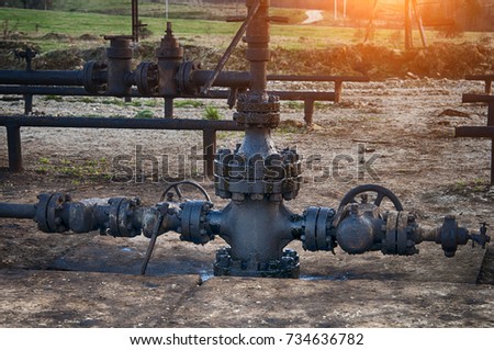 Spilled crude oil around oil field. Oil and Gas Industry