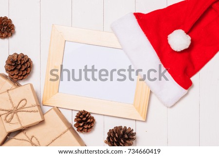 Christmas presents in decorative boxes on white wooden table background