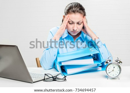 Tired accountant with severe migraine forced to work overtime conceptual photography