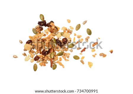 Top view photo of granola pile isolated on white background, muesli texture, scattered seeds pattern, cereal grain for good health Royalty-Free Stock Photo #734700991