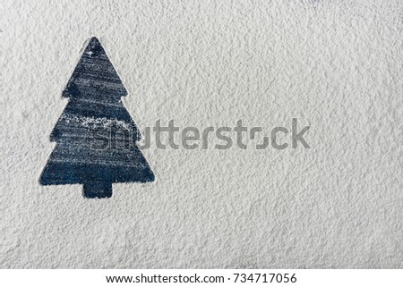 Blue Christmas Tree Silhouette on Snowy White Background. New Year Holiday Greeting Card. Poster Template. Baking Copy Space. Creative Image. Sales Shopping Advertisement
