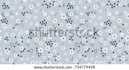 Delicate blue flowers texture. Cute flowery pattern for fashion print. Seamless floral background for design fabric, wallpaper, wrapping, paper.