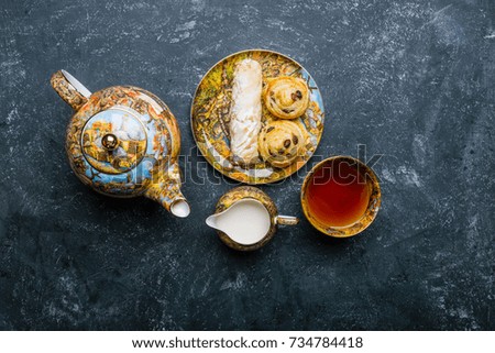 Tea set. Oriental sweets bakery. Top view. Dark background