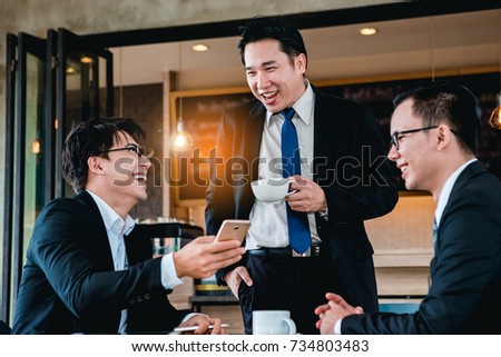 A group of men are businessmen sit together and succeeded in finding the various agreements.