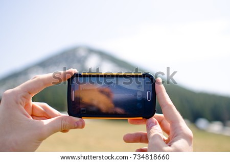 The handset takes a snapshot of the mountain