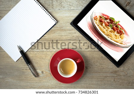Tablet with picture of spaghetti with tomato sauce and blank ingredients list