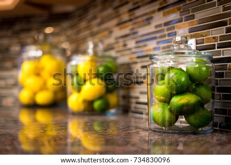 Close up of Limes and Lemons on a kitchen counter 