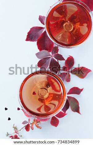 image of two glasses of  red champagne on white background 