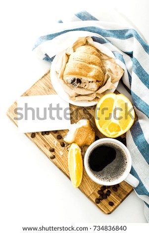 Morning coffee with croissant on the table