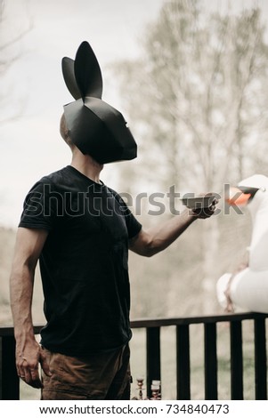 Man with black rabbit mask