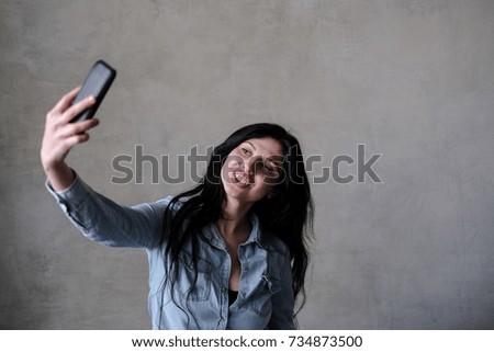 Woman doing selfie on the mobile phone