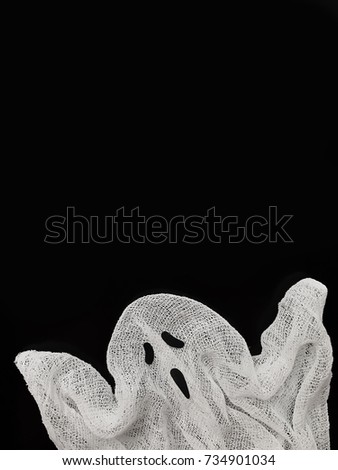 Minimalistic Halloween collage made of ghost on black background