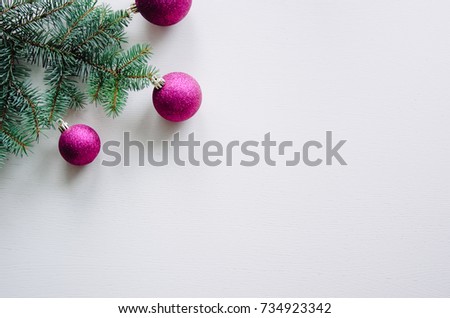 New year's background on a white desk decorated with toys, presents, Christmas tree, candles. Bright colored background symbolizes the new year celebration. Great useful template to wright words down.