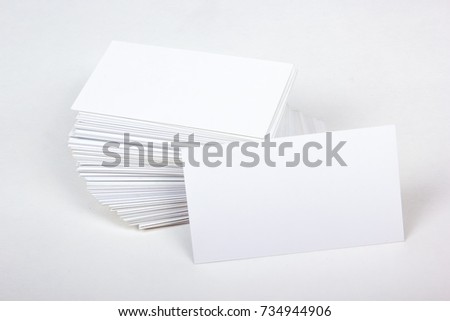 Mockup of business cards fan stack at white textured paper background