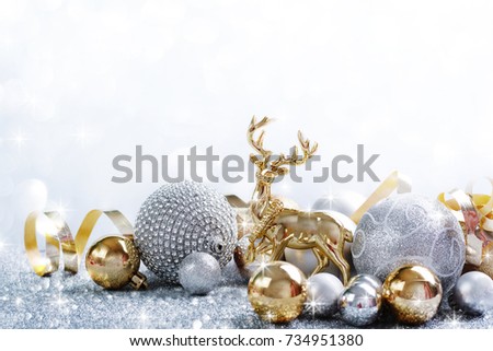 Christmas festive background with beautiful golden deer and Christmas balls.