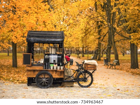 Coffee bicycle in the autumn park