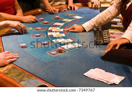 friends playing in casino black jack table Royalty-Free Stock Photo #7349767