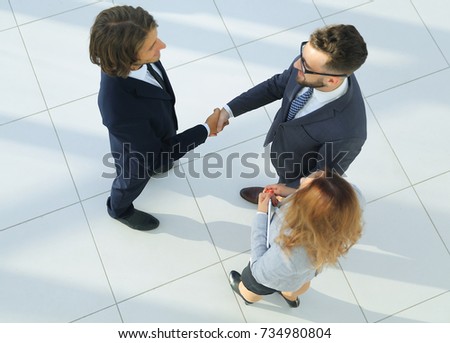 Closeup picture of businesspeople shaking hands.