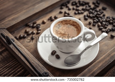 Coffee Espresso. Cup Of Coffee on wooden background closeup.