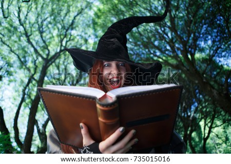 Photo of screaming witch in long black hat