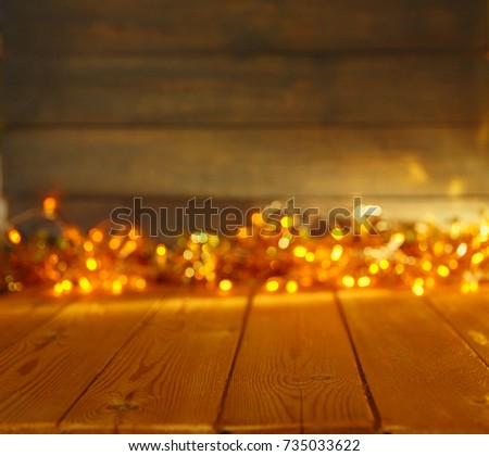 Wooden background with bright lights with a free space for text or product demonstration