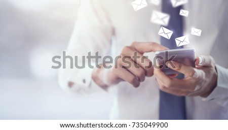 New messages on mobile phone, hands of businessman opening inbox to view the pending e-mail communication, copy space. Royalty-Free Stock Photo #735049900