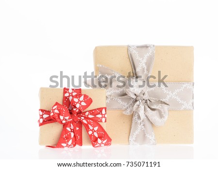 Christmas brown gift boxes wrapped with red ribbon isolated on white background
