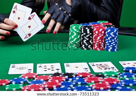 cluseup picture of a winning hand at poker - four aces, two in handm two on the table