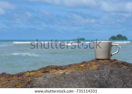 Coffee cups on the stone background natural sea.