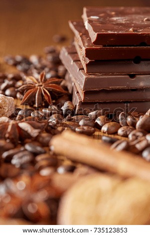 Aroma coffee chocolate cookies and spices on the wooden table. Dark wooden background. Top view. Close. Closeup.