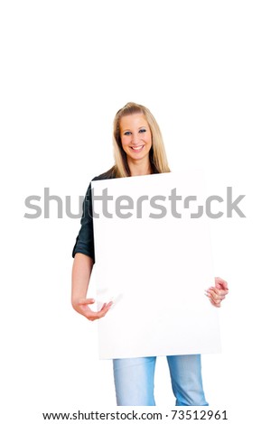 Portrait of a smiling young woman presenting blank bill board over white wall