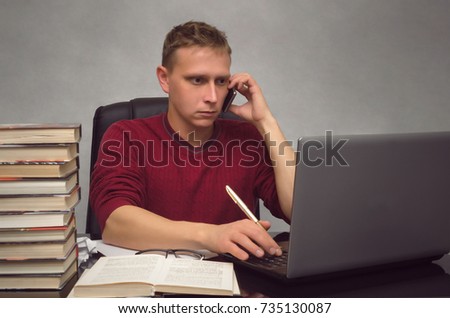 Hardworking businessman working with laptop computer on the office desk table. Student studying and looking for information in internet by using laptop computer.