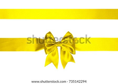 Single lemon yellow satin gift bow with tails with two ribbons isolated on white 