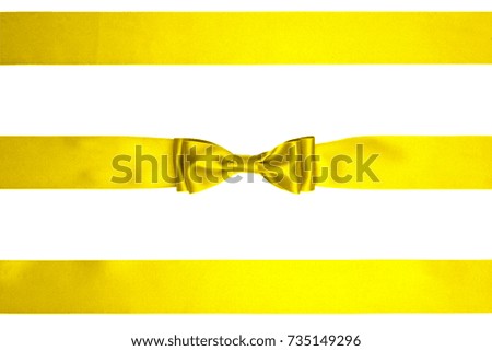 Single lemon yellow silk bows with three ribbons isolated on white