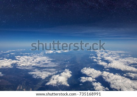 High altitude view between sky and space , in to the dark. Sky view plane. Royalty-Free Stock Photo #735168991