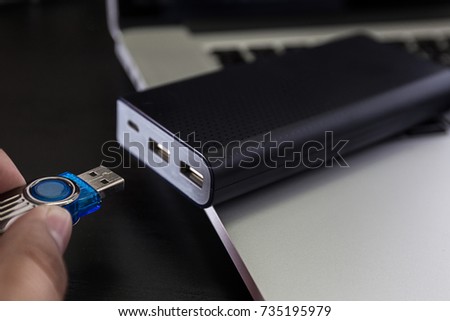 USB flash cards and thumb drive or stick Virtual memory storage with USB cable into slot  laptop computer