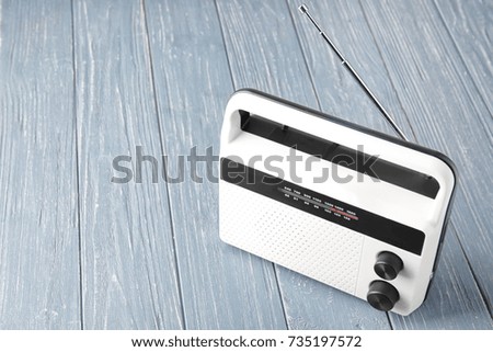 Radio receiver on wooden background