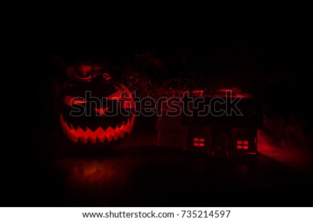 Apocalyptic Halloween scenery with old house pumpkin. Horror zombie near the abandoned house