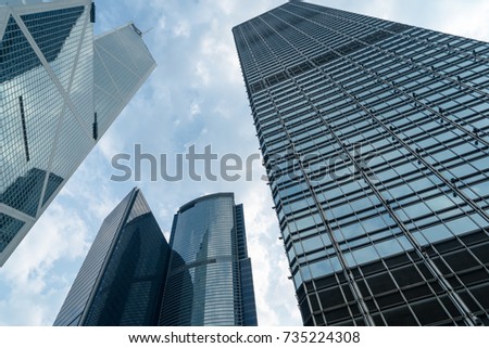 directly below of modern financial skyscrapers in central Hong Kong,blue toned,china.