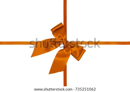 Single diagonally orange silk gift bow with tails with cross ribbons isolated on white