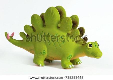 Toy plastic dinosaur over white, stegosaurus