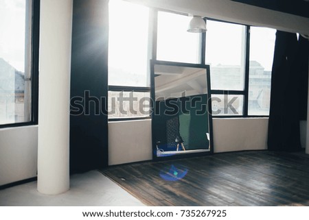 huge mirror on panoramic black windows 