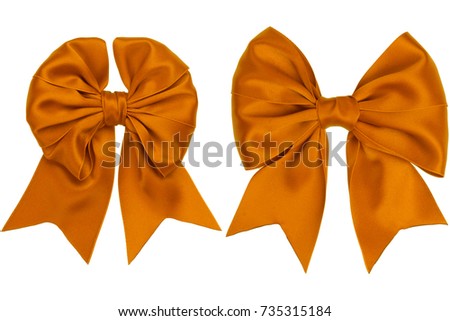 Two orange satin ribbon bows on white background