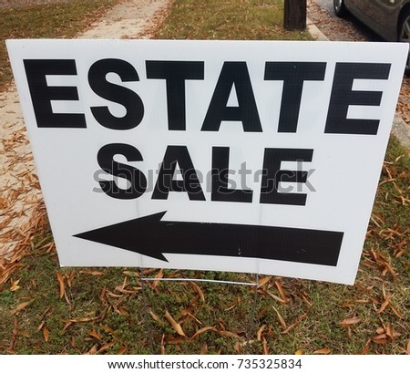 estate sale sign with left arrow
