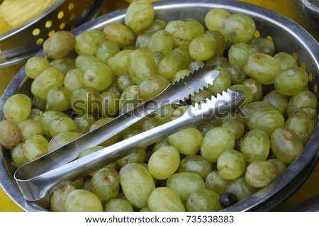 Grape dissolved and mixed with ice to maintain freshness. Put in a bowl and be displayed on the table for guests to take.