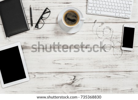 Office desk with cup of coffee, tablet pc, mobile phone. Business background with space for your text image picture. Flat lay. 