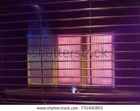 Pilot-flame on a portable gas heater Royalty-Free Stock Photo #735400801