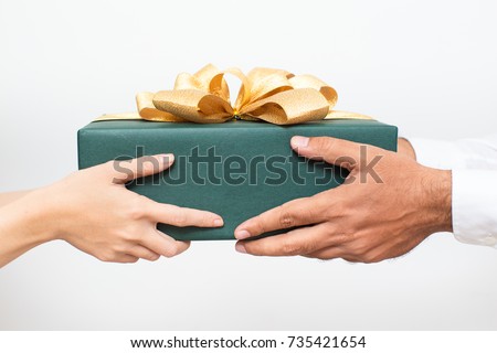 Couple holding packaged Christmas present together
