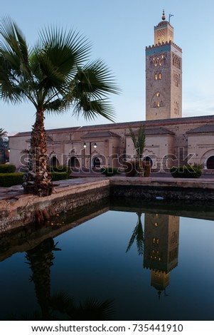Koutoubia-Mosque in Marrakesh with mirror picture in water basin photo taken during golden hour 
