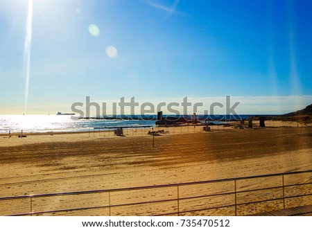View of the beach lit by the bright sun